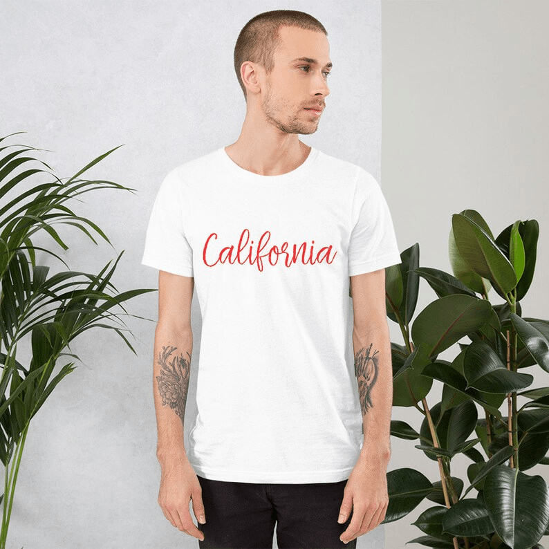 White T-shirt with California written in red cursive across the chest